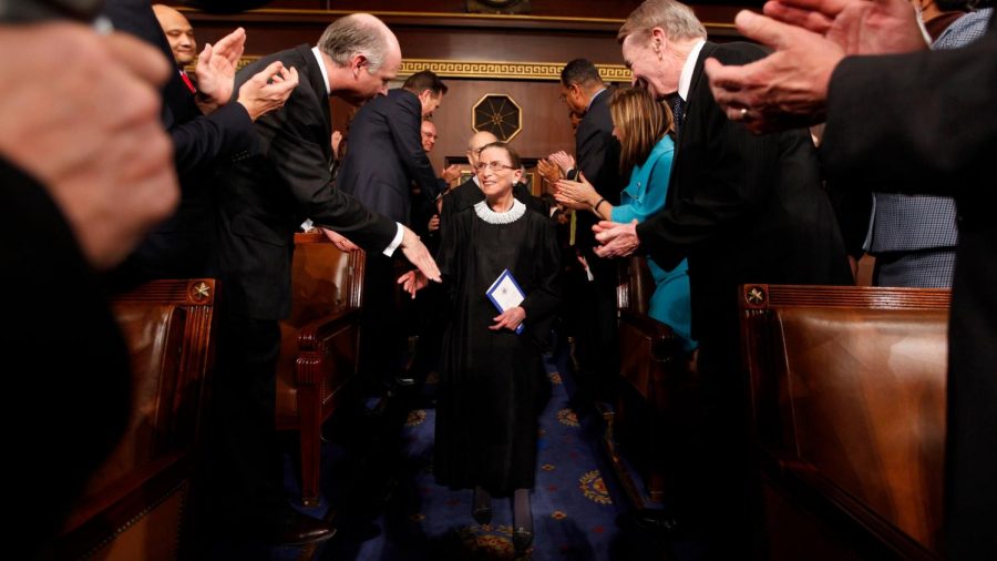 Supreme Court Justice Ruth Bader Ginsburg returning to her bench after missing a day at the court.