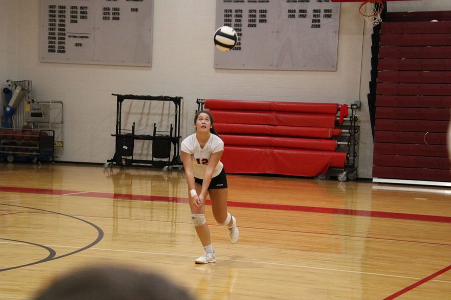 Junior Bailey Chin goes up to bump the ball.