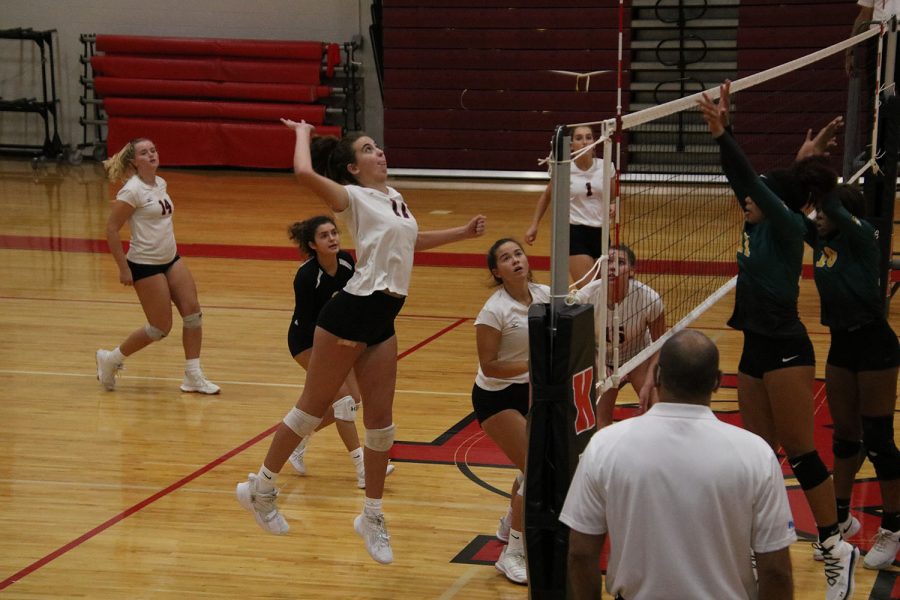 Senior Emma Fraidenburg goes up for a hit.