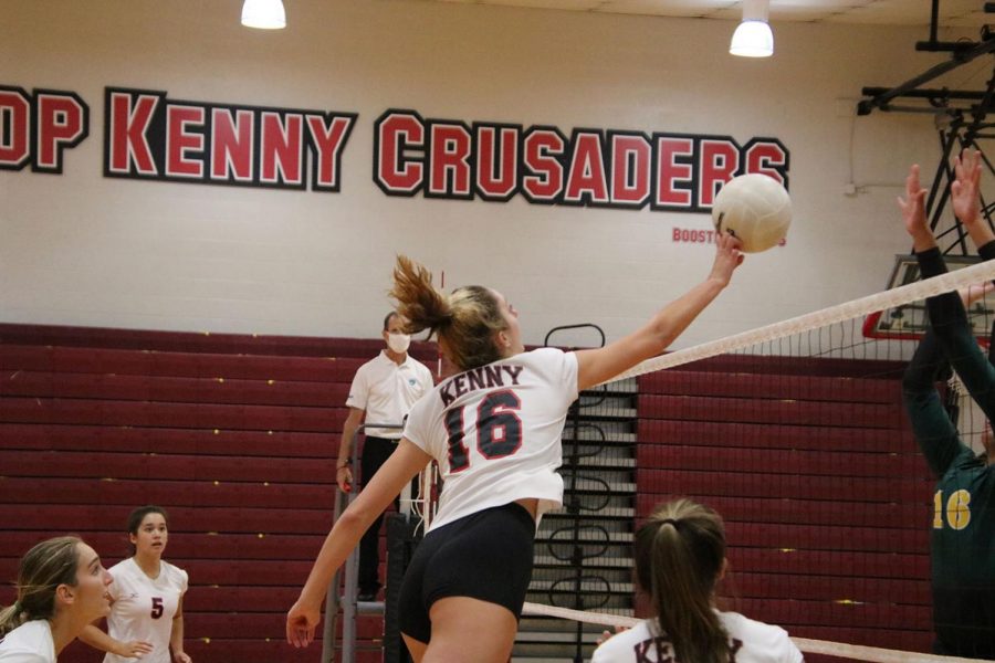 Sophomore Allison Cavanaugh tips the ball over the net. 