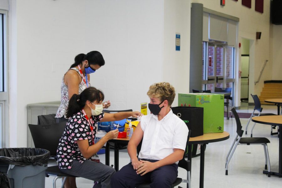 Freshman Ryan Baggett gets his flu shot.