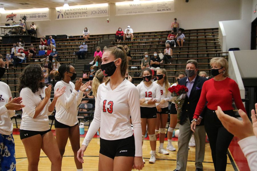 Senior Ashton Dilts walks on the court for Senior Night.