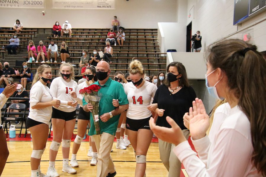 Senior Emilie Chinault walks on the court for Senior Night.