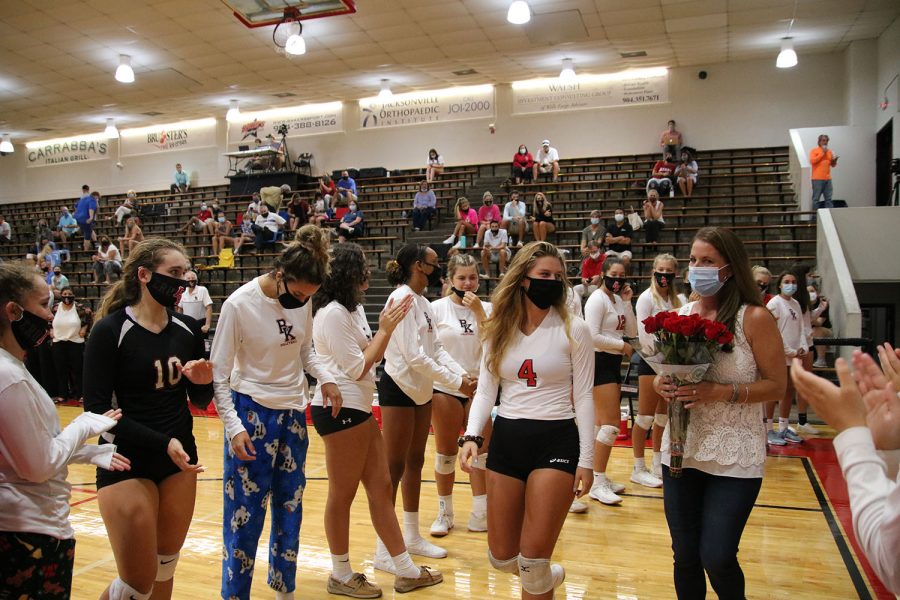 Senior Hailey Gomer walks on the court for Senior Night.