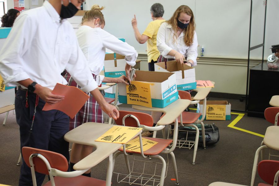 Students in St. Vincent de Paul Society help to get boxes ready for the Thanksgiving food drive.
