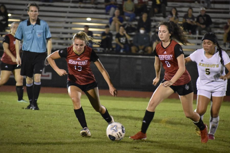 Senior Chloe Shaw and junior Victoria Rojas attacking the ball trying to defend goal from being scored on by Knights. 