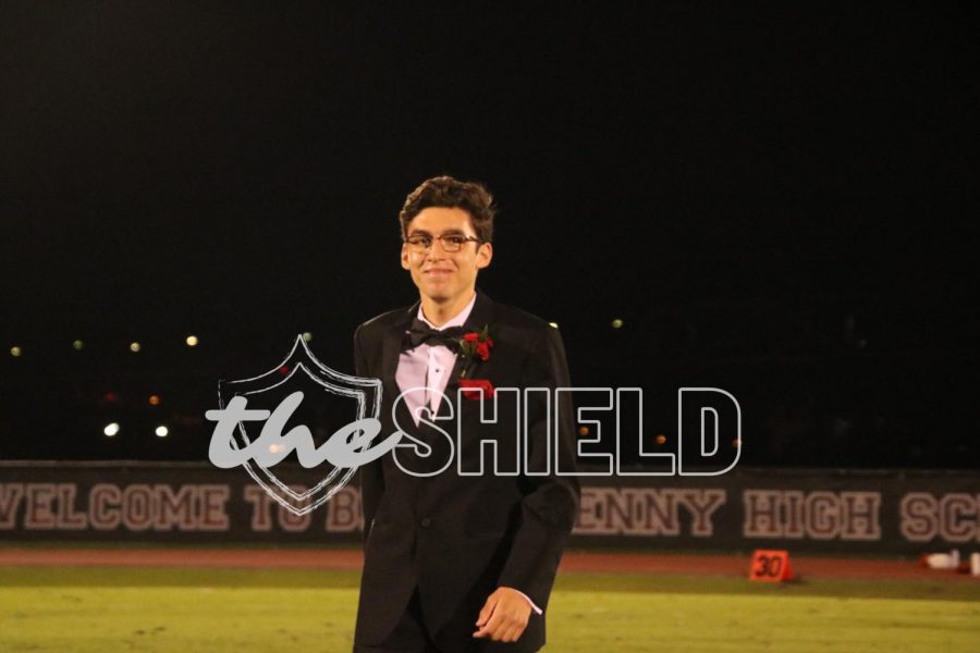 Senior John Cratem walking down the field.