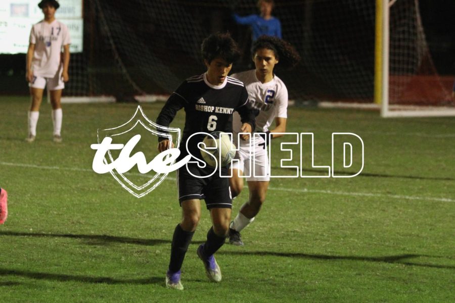 Junior Patrick Russell  gains control of the ball on the offensive side.