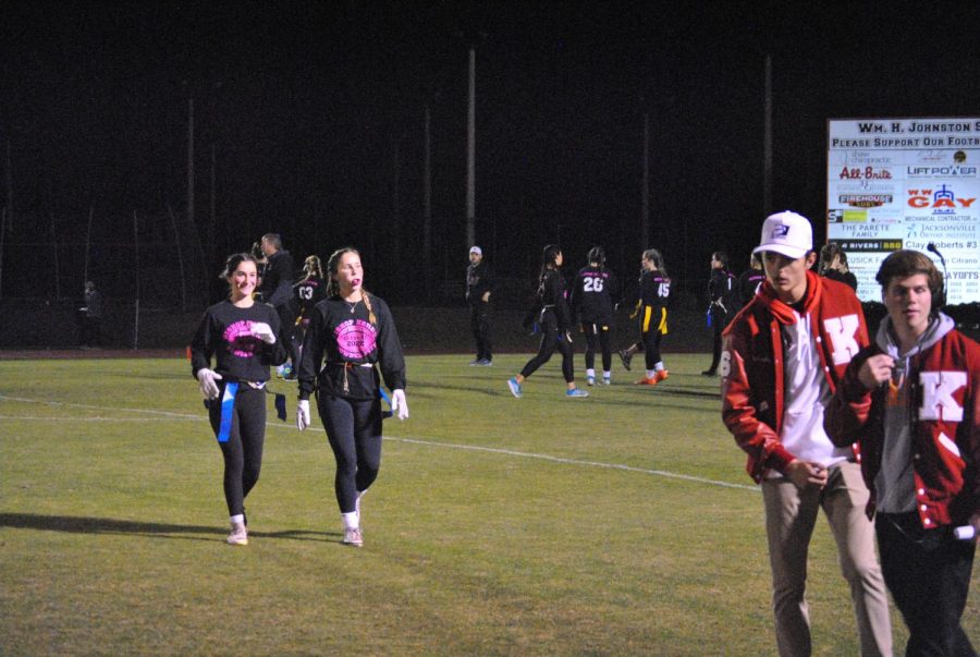 Seniors Adriana Gjergji and Grace Devine walking off the field after making an offensive play