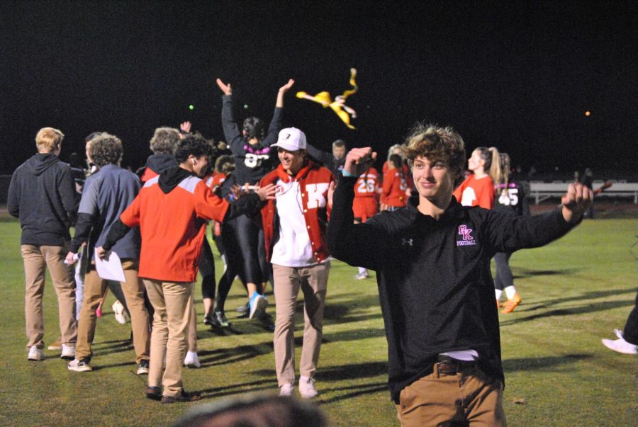 Senior coaches Nick Ruen, Pat McCarthy and Brian Gjoka celebrating after a touchdown made by the Senior Women