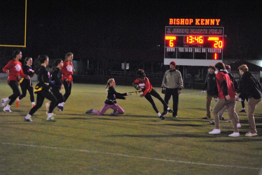 Senior Gianna Geraci pulling Junior Gabby Johnson's flag