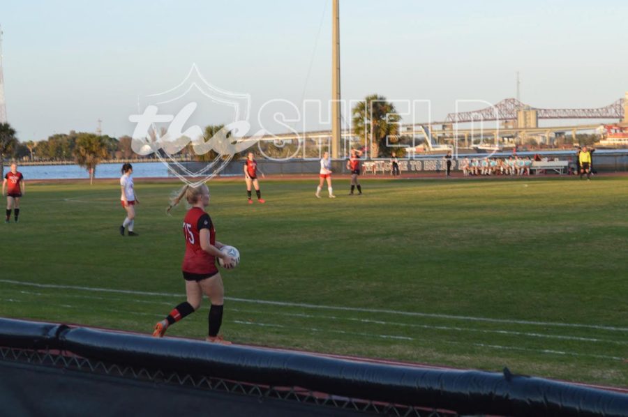 Senior Abby Measor plans to throw the ball to a Crusader. (Photo credit to Addison Mark.)