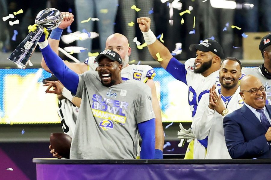 Von Miller holds up the Lombardi Trophy after Rams win. (Photo courtesy of Turf Show Times.)