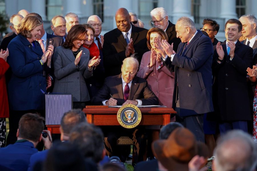 Biden signs the Bipartisan Funding Bill (photo credits to Jacob Pramuk)