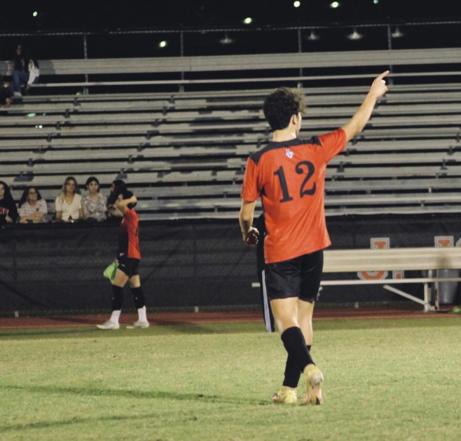 Junior Diego Calderon points to his teammates. 