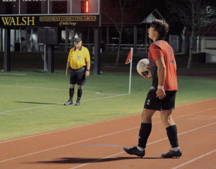 Senior Cody Morgan prepares to kick the ball.