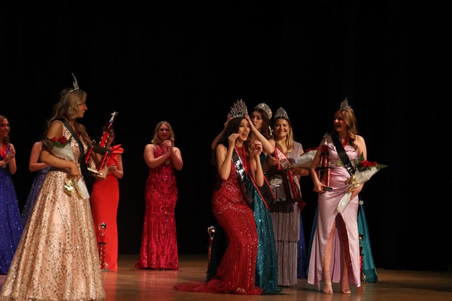 The previous Miss BK senior Anabel Macchi, crowns junior Giovanna Feitoza as Miss BK along with junior Aleah Grayce Gibbs and junior Mary Smith