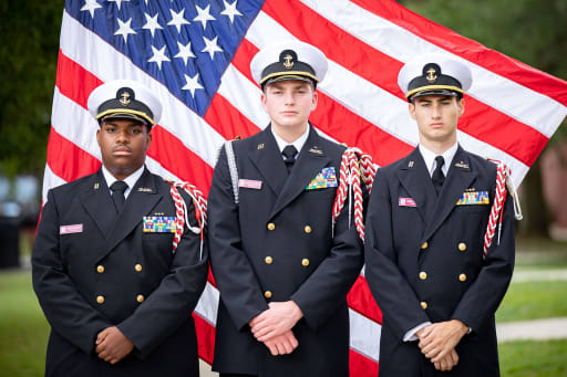 Former cadets pose for a staff photo