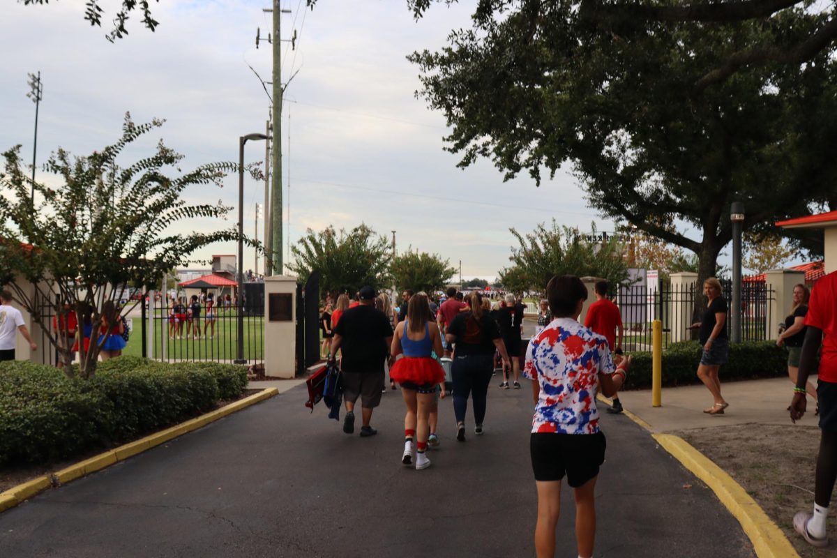 Students walk into Bishop Kenny football game against Tocoi Creek
