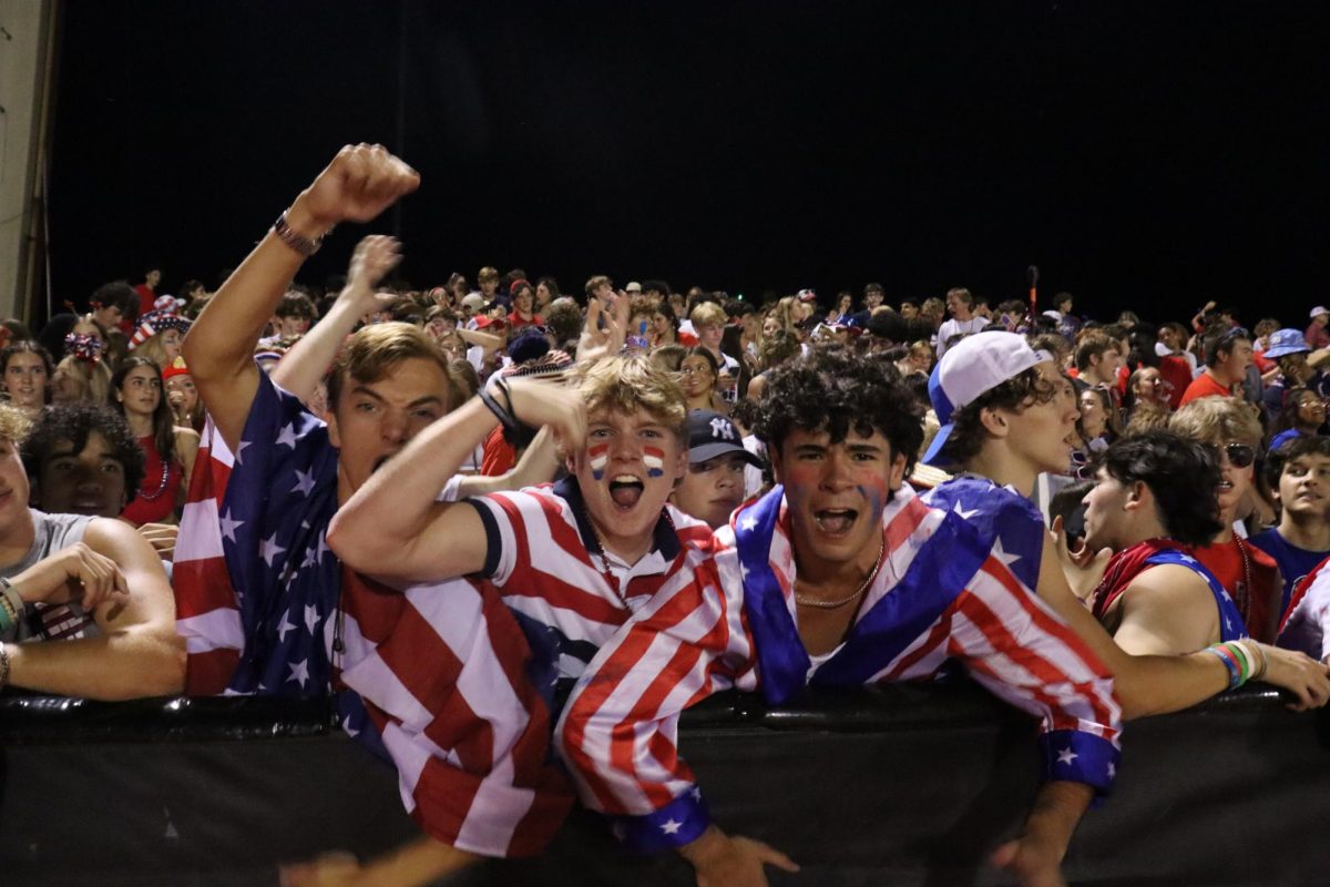 Seniors Caleb Couch, Graham Bright and Luke Wilson (left to right) celebrate after the game winning touchdown.