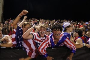 Seniors Caleb Couch, Graham Bright and Luke Wilson (left to right) celebrate after the game winning touchdown.