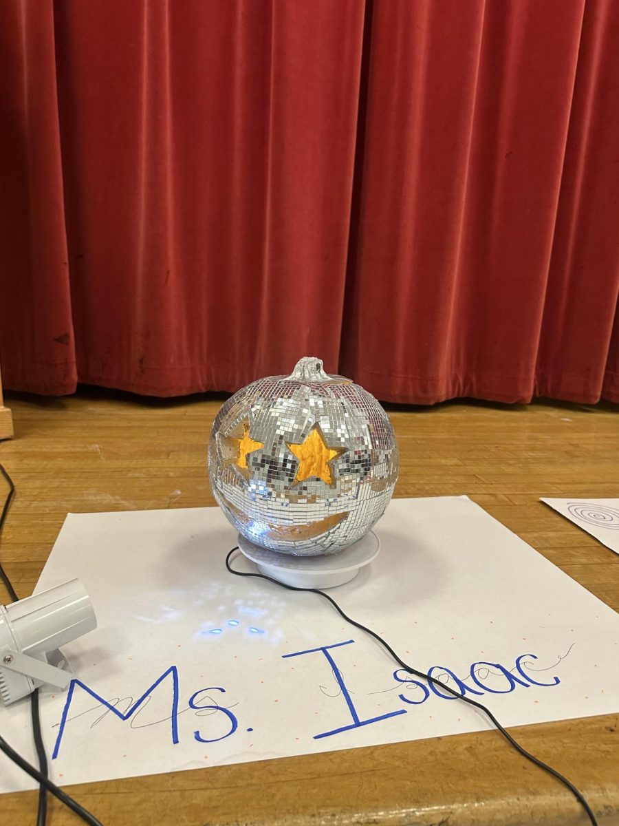English teacher Grace Isaac's pumpkin, which rotates and has a light reflecting off of it, is a reference to “mirrorball.”
