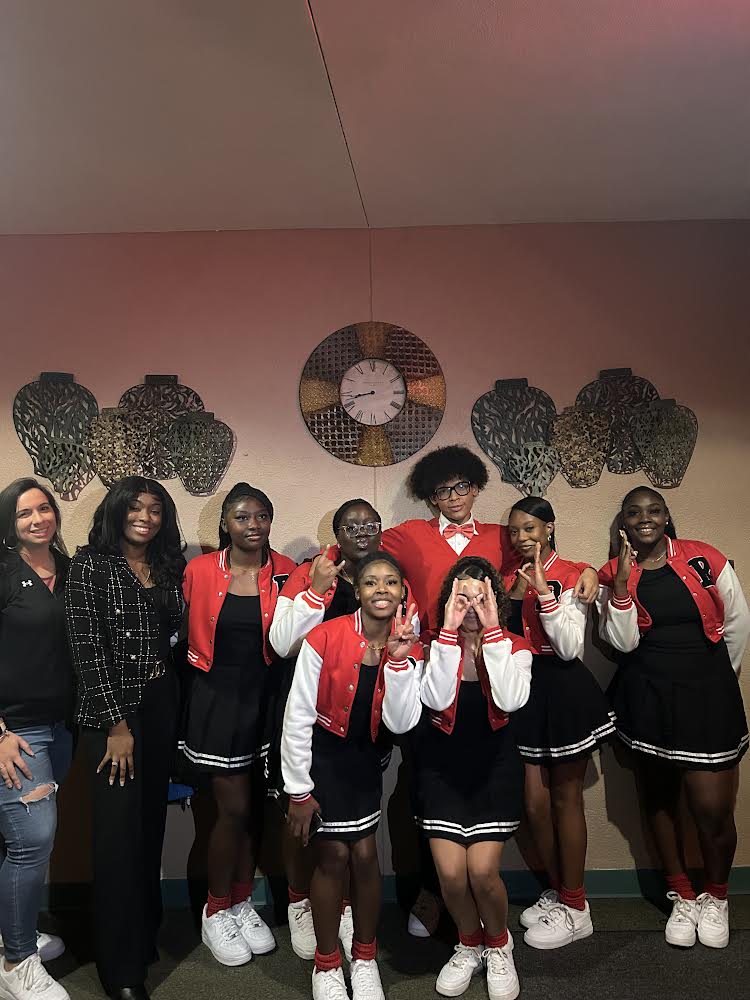 Step Team celebrates their win with a photo. 