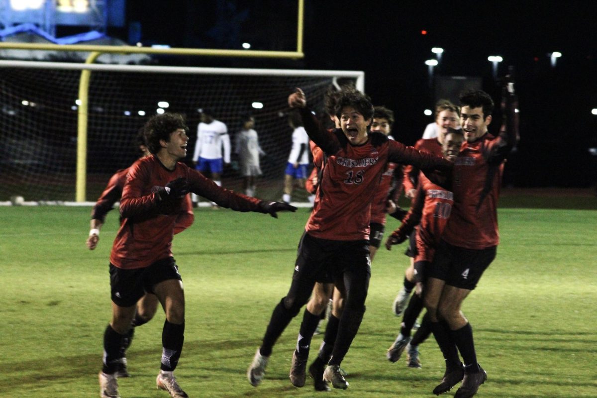 Senior Hayden Bray points to the student section after scoring his goal