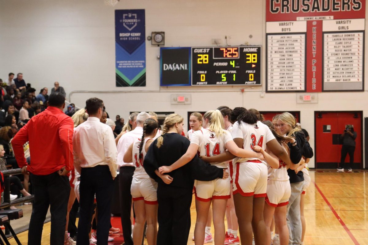 The team huddles together during a time out.