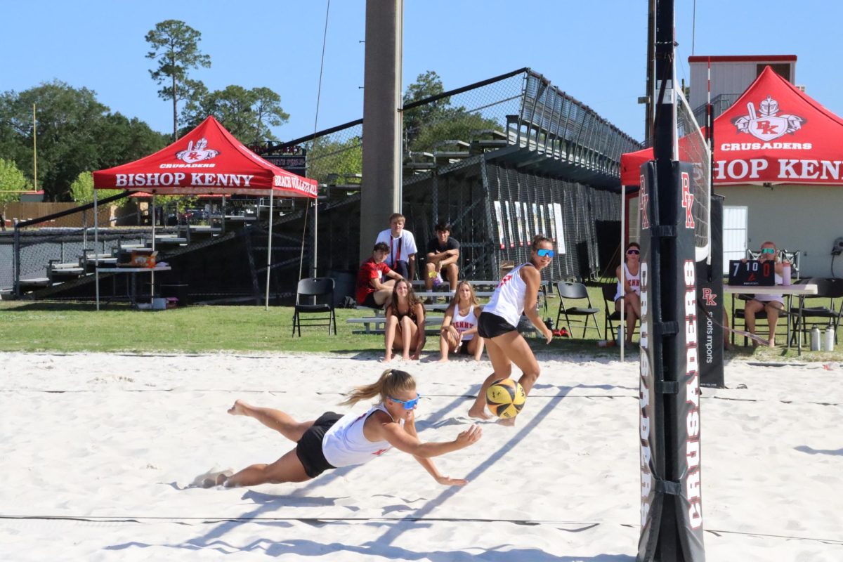Diving for the ball, senior Cami Labyak tries to get the ball up to her team mate junior Olivia Ryno.