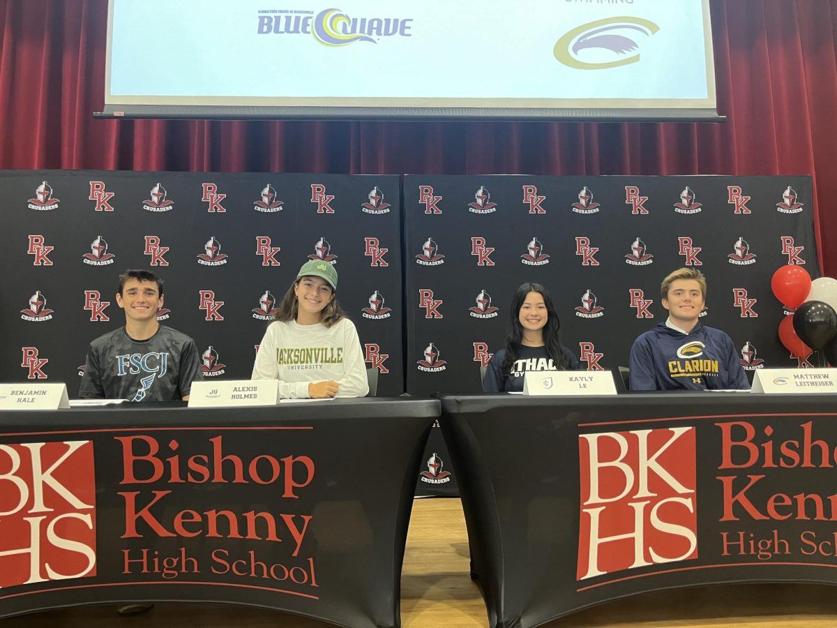 The commits (from left to right) Ben Hale, Alexis Holmes, Kayly Le and Matthew Leitheiser pose for a photo.