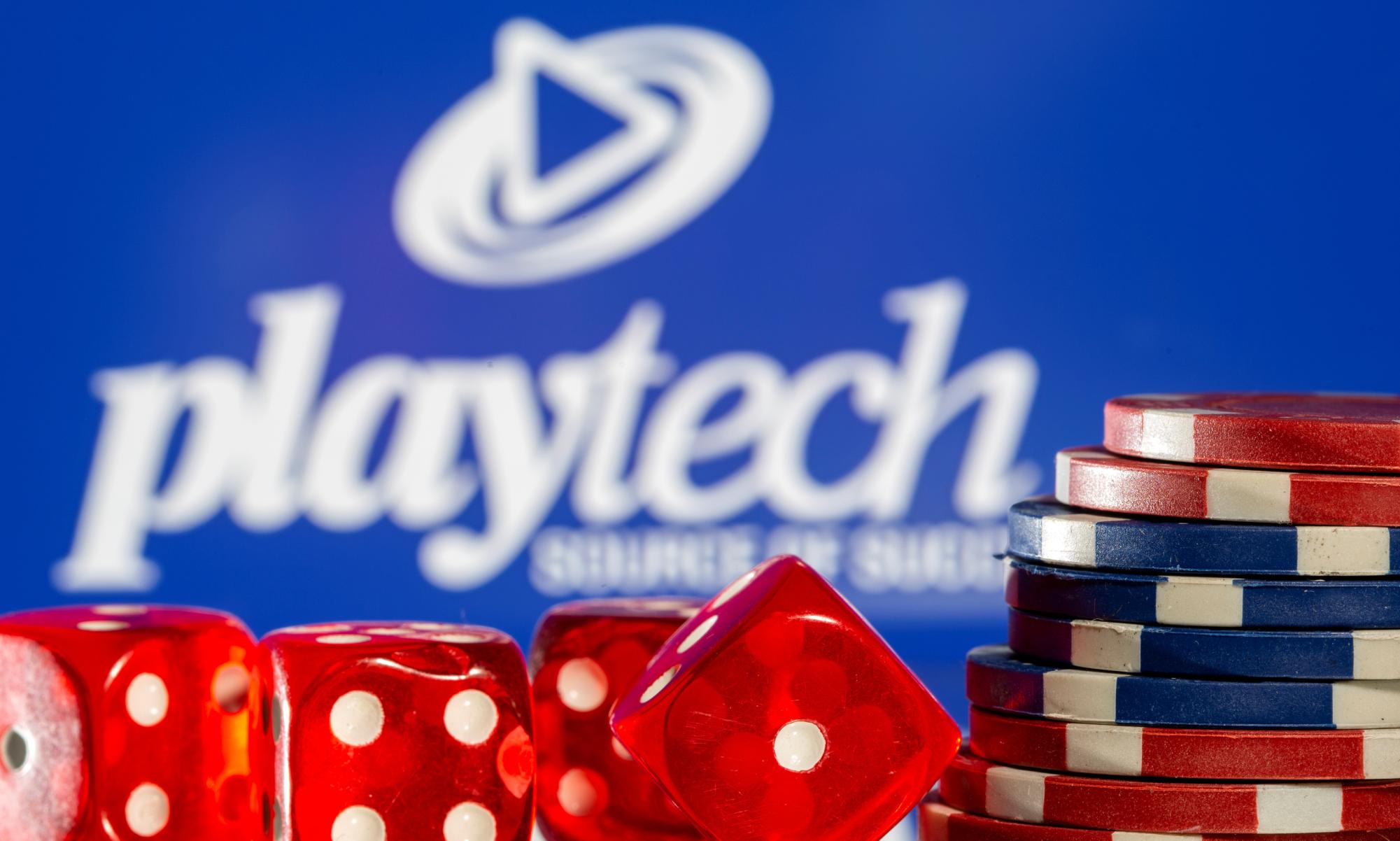 Gambling cubes and chips are seen in front of displayed Playtech logo in this illustration taken, November 8, 2021. REUTERS/Dado Ruvic/Illustration