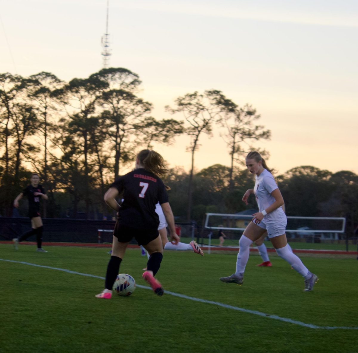 Freshman Shea Donovan prepares to cross the ball to a teammate at the regional final game against the Vanguard Knights on Tuesday February 17.