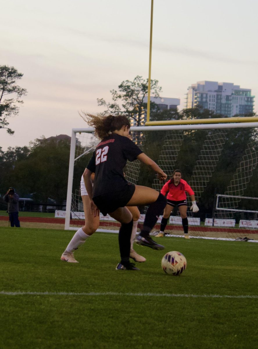Senior Stella Jones cuts the ball back to beat a defender in the Regional Final game against the Vanguard Knights on Tuesday February 17.