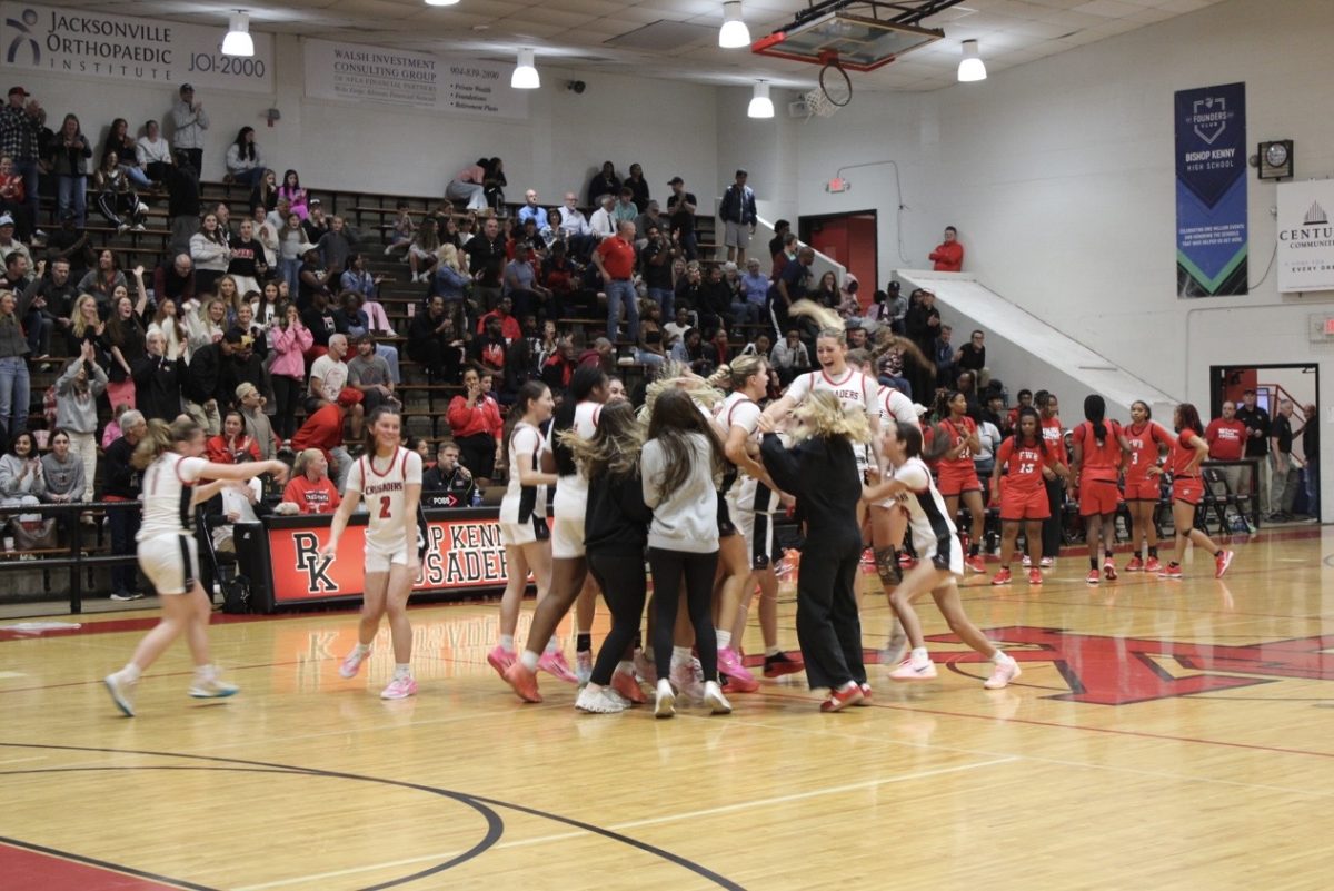 Immediately, the team celebrates its regional win.