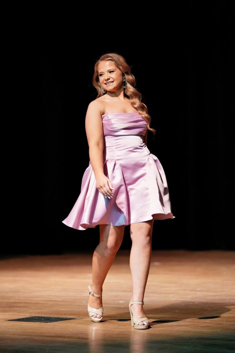 Contestant #5, Rebekah Jones, struts her stuff during the casual wear modeling portion of the pageant.