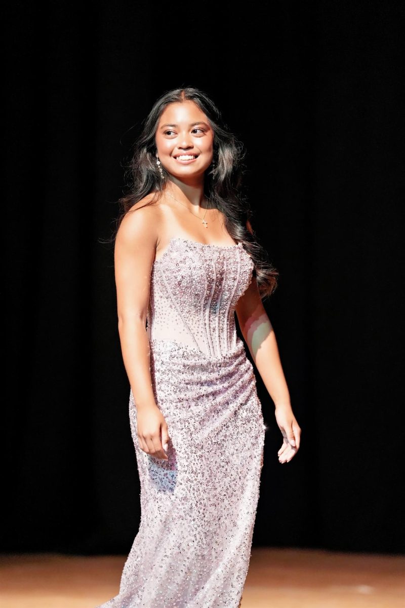 In a sequined gown, Kara Odavar models for the formalwear portion of the pageant.