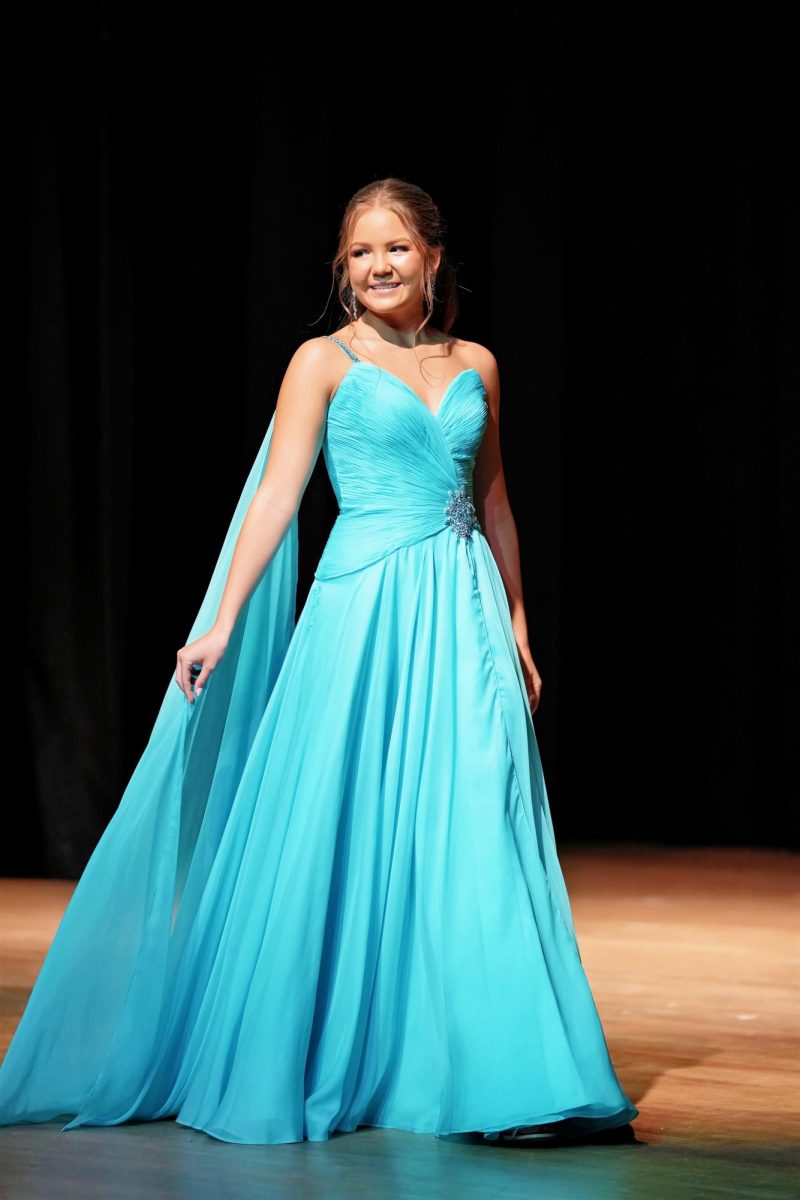 During formalwear, Seanna Mead glides across the stage in an aqua gown.