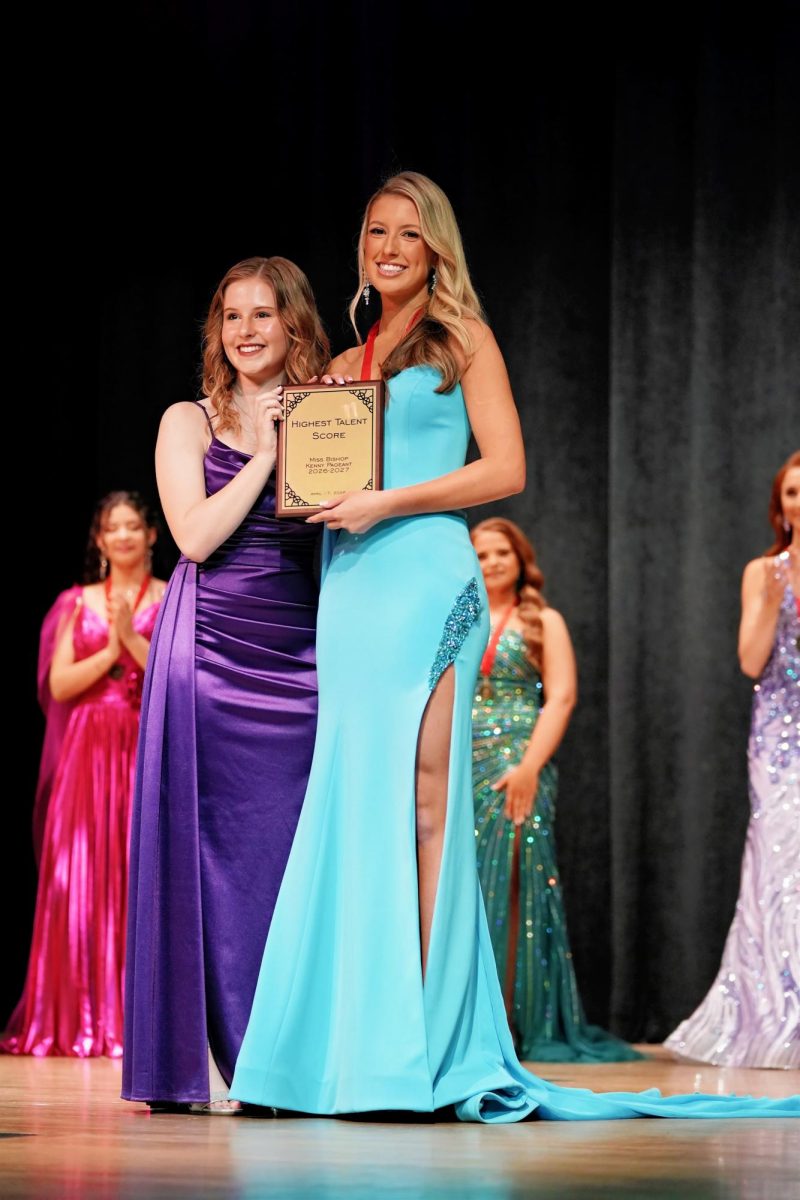 Hannah Riederer presents Sophie Isaac with the award for Most Photogenic, and also won the award for the highest talent score.