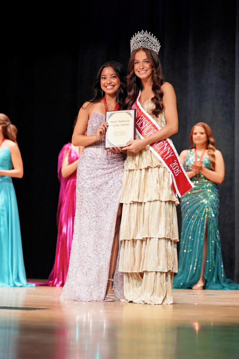 Sheridan Delegal presents Kara Odavar with the award for most service hours earned of all the contestants -- nearly 365 hours. 