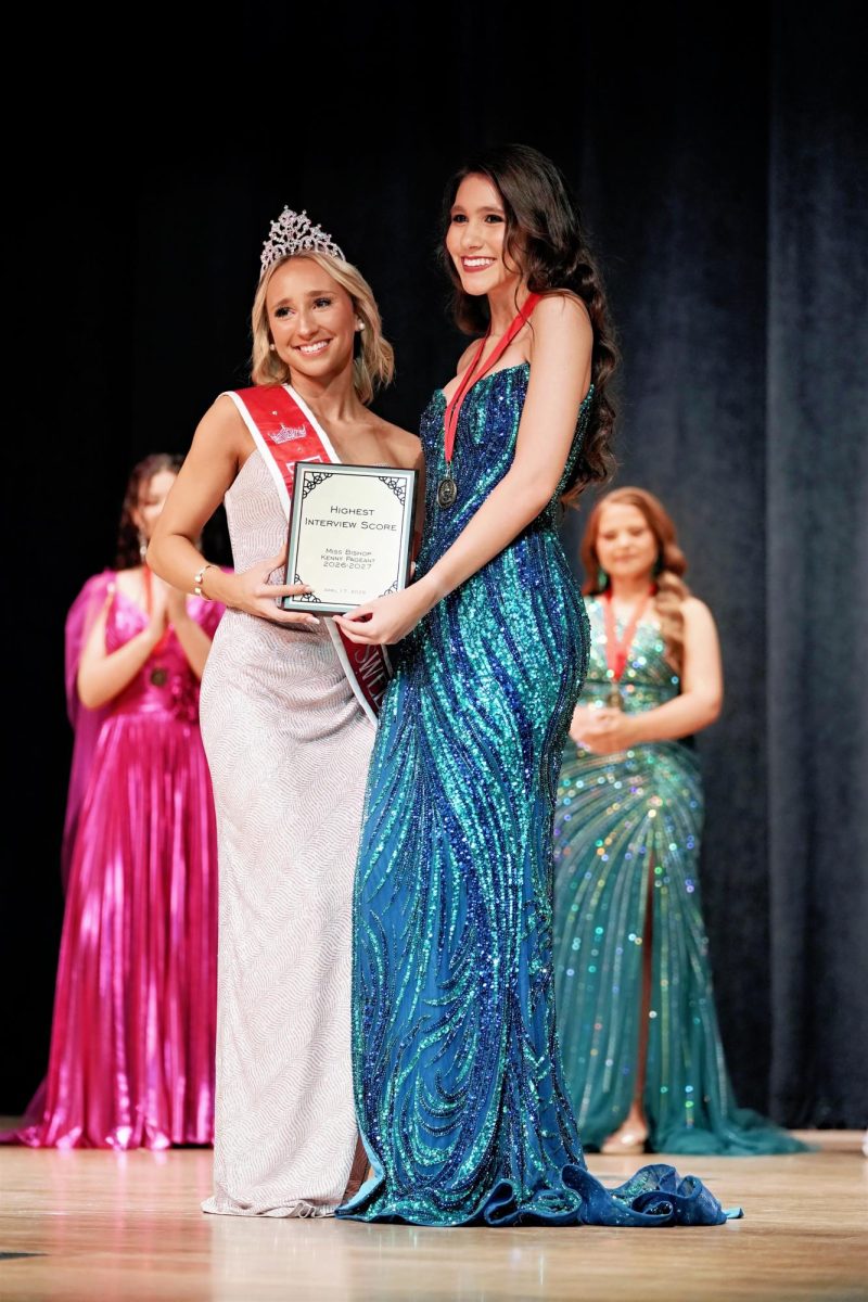 Chloe Vought presents Carolina Bettega Feitoza with the award for highest interview score from the judges.