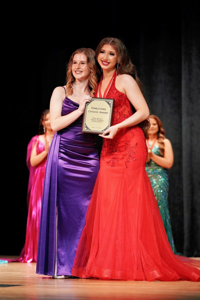 Hannah Riederer presents Evelyn Mountjoy with the Director's Choice Award, given to the contestant who the faculty sponsors voted as most dedicated and reliable. 