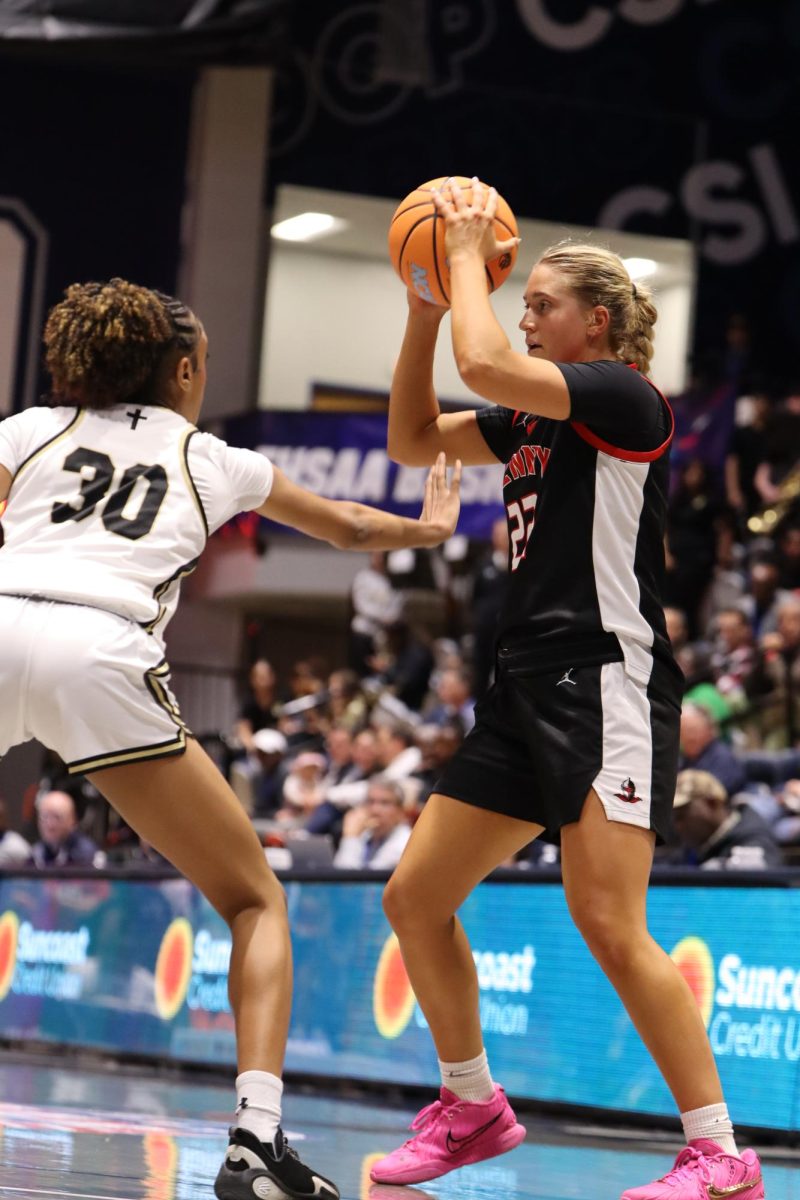 Junior Kathleen Crawley prepares to pass the ball off to teammate on Thursday March 12, 2026 at the girls class 4A State Championship.